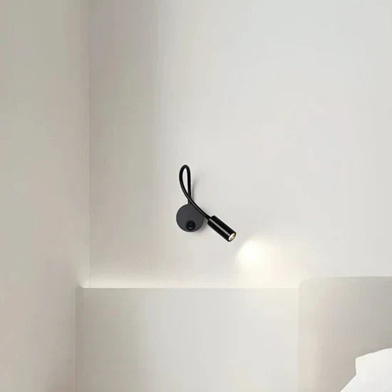 Lumio Flexible black LED wall lamp for indoor use